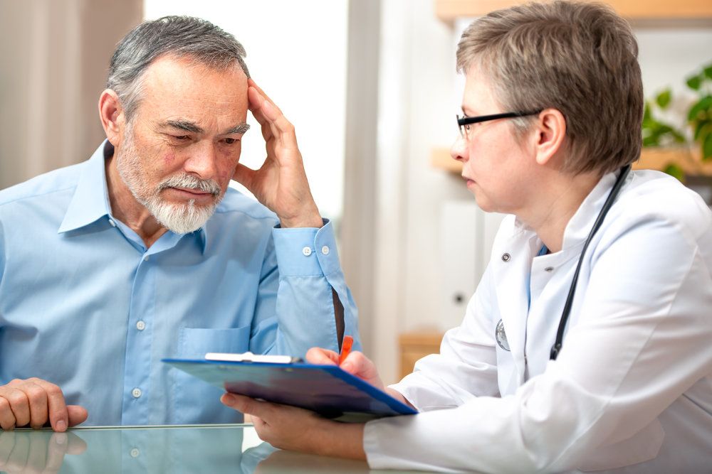 Doctor consulting with concerned looking patient